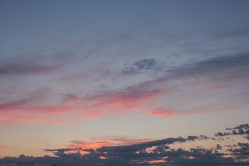 Free Low angle of scenic peaceful sky with bright blue and pink clouds in sundown Stock Photo