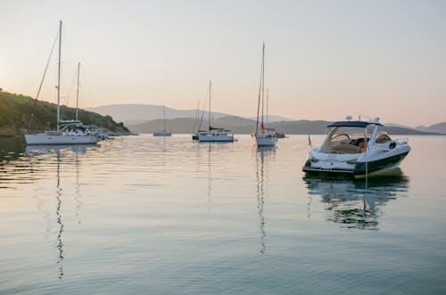 Calm boats floating in sea