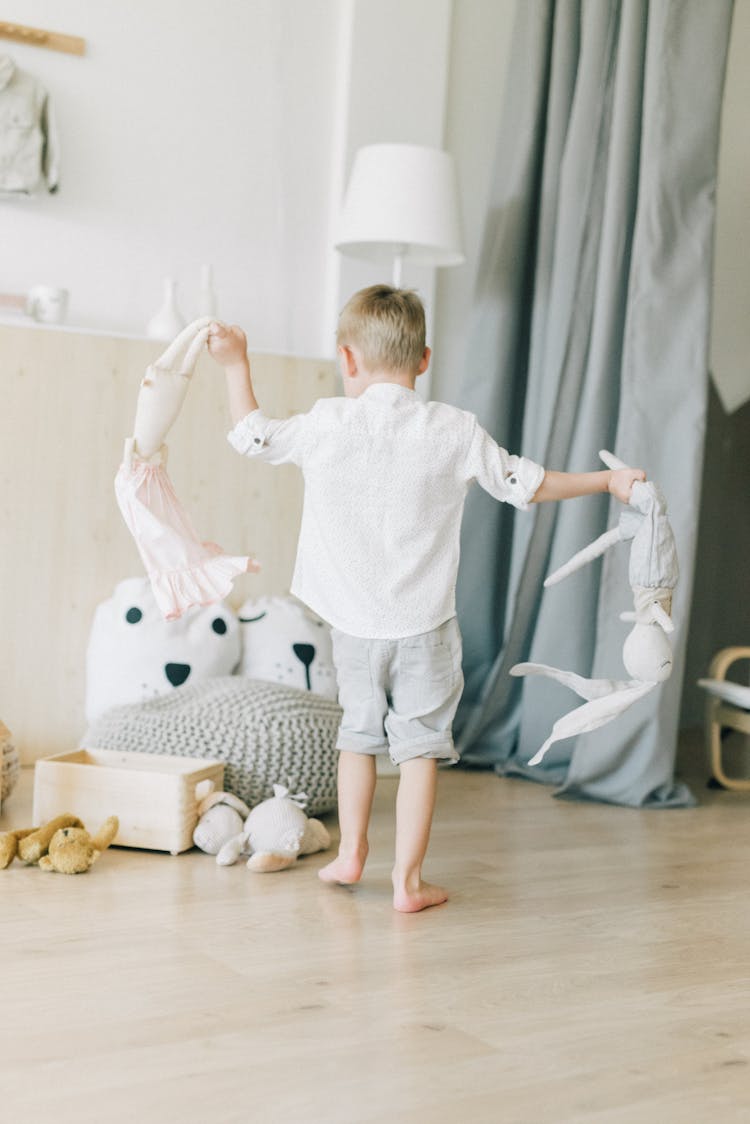 Cute Boy Playing With His Toys