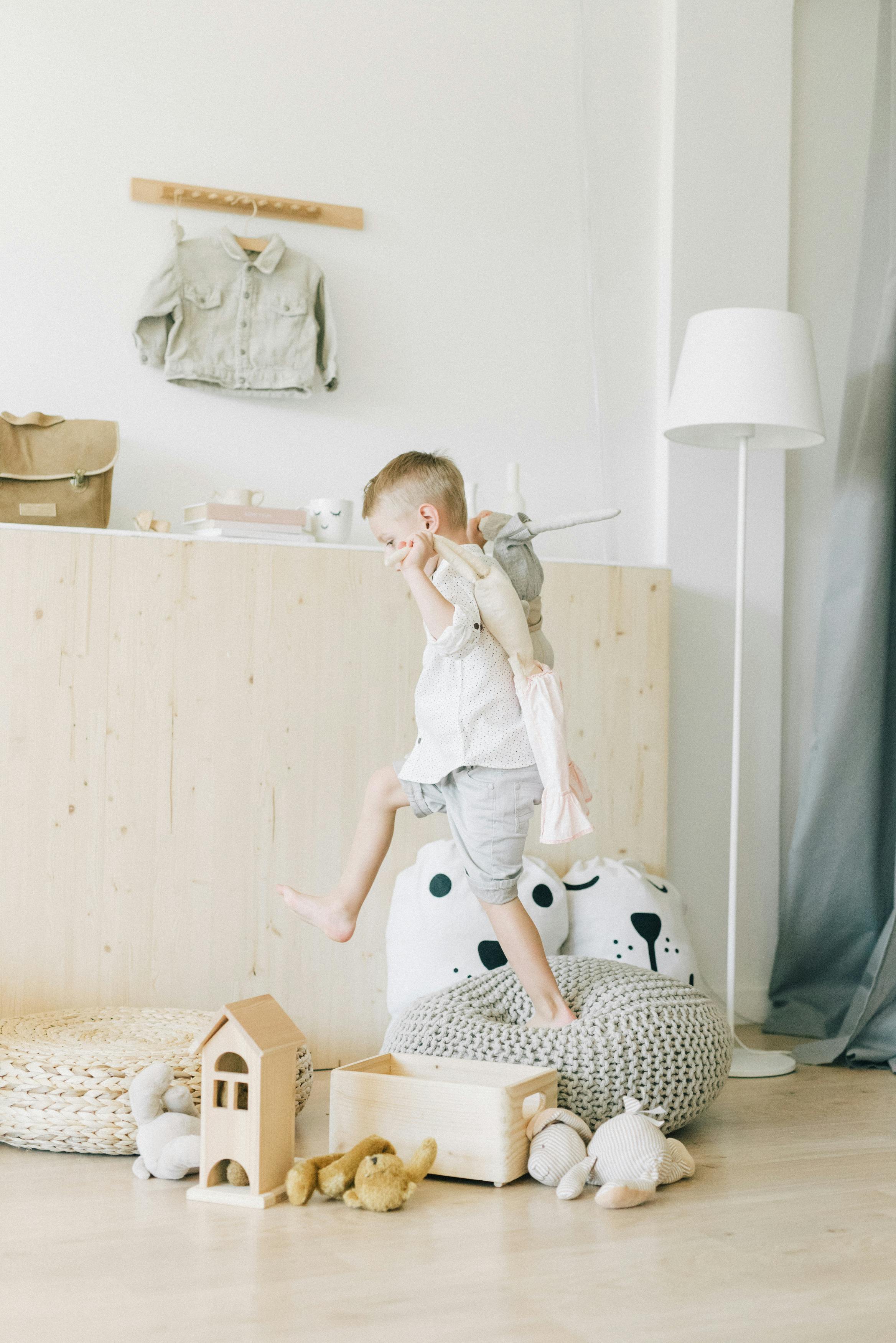 cute boy playing with his toys