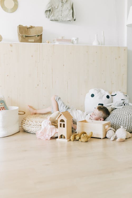Free  A Boy Resting on Pillows Stock Photo