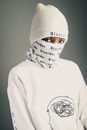 Serious black woman in balaclava and warm sweater