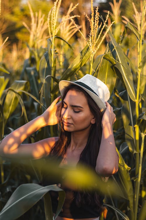 Woman Wearing a Hat at the Corn Field