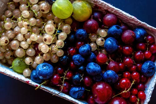Free Overhead Shot of Fresh Berries in a Container Stock Photo