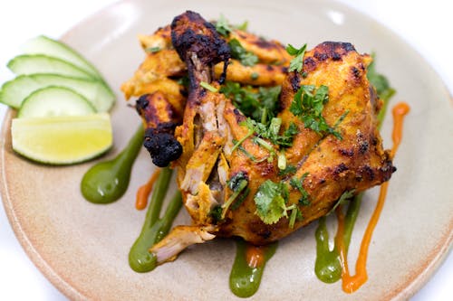 Fried Chicken with Green Sauce on White Ceramic Plate