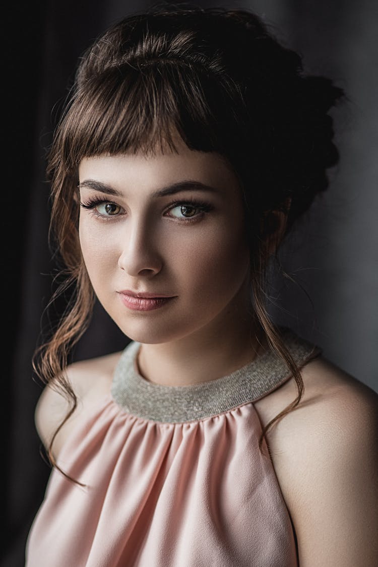 Woman With Elegant Hairstyle In Studio