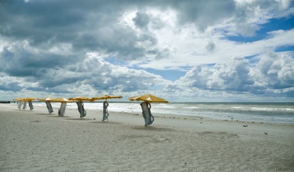 
A Beach under a Cloudy Sky