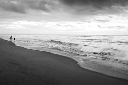 Grayscale Photo of Sea Waves Crashing on Shore