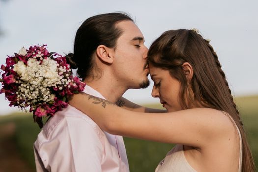 Man Kissing Womans Forehead