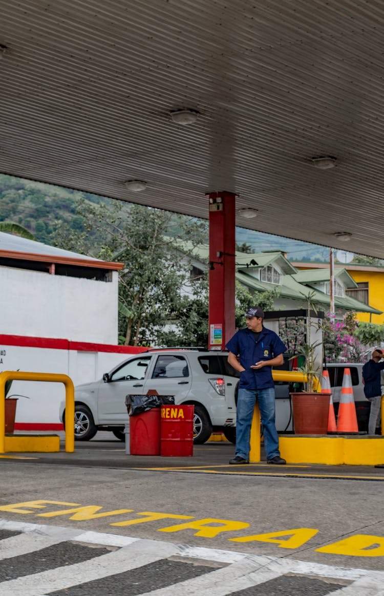 Man Buying Gas At Gas Station 