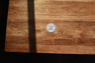Top View of Pog Lying on Wooden Table