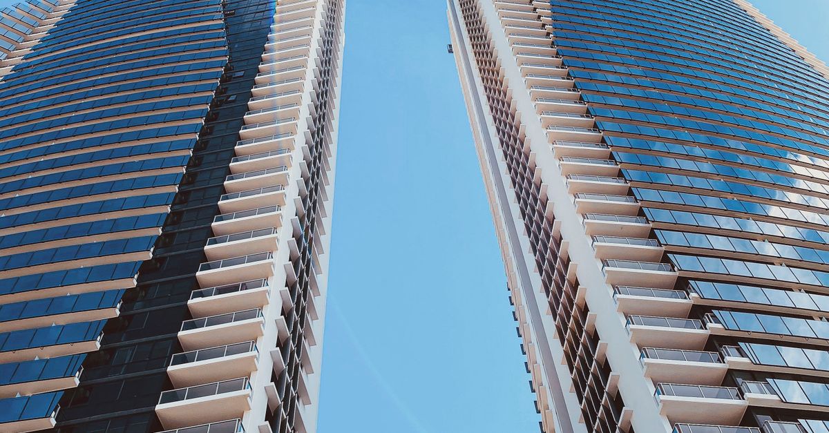 High Rise And Low Rise Building Low Angle Shot of High-rise Buildings · Free Stock Photo