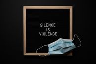 Composition of framed Silence Is Violence inscription on black background with face mask