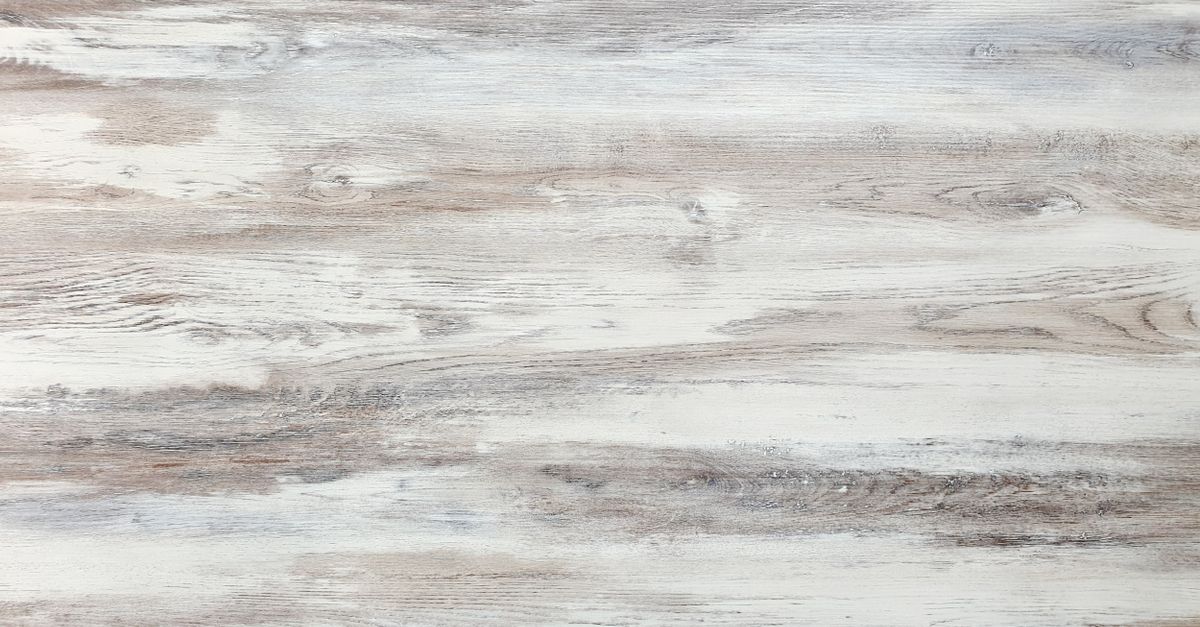 Close-up of a rustic hardwood surface featuring natural wood grain and texture, ideal for backgrounds.