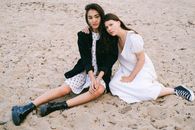 Women Sitting on Sand