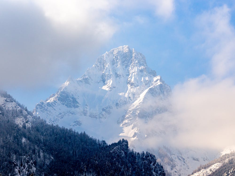 Free Snow Capped Mountain Under Cloudy Sky Stock Photo