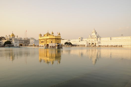 Golden Temple in Amritsar, India, beautifully reflecting in the water during sunset.
