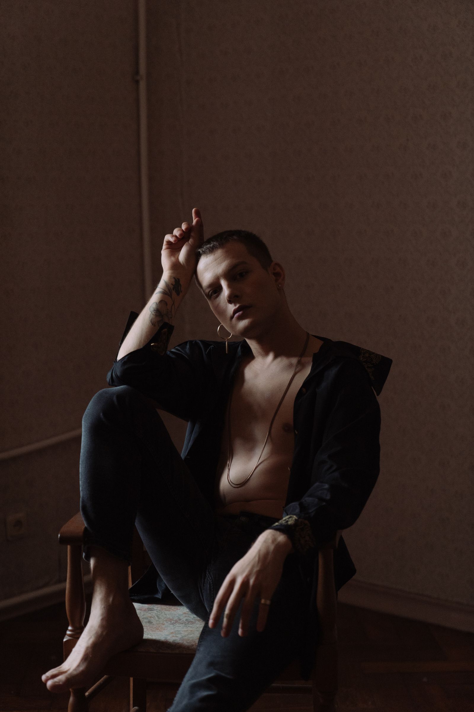 Person putting on socks while seated in bright natural light