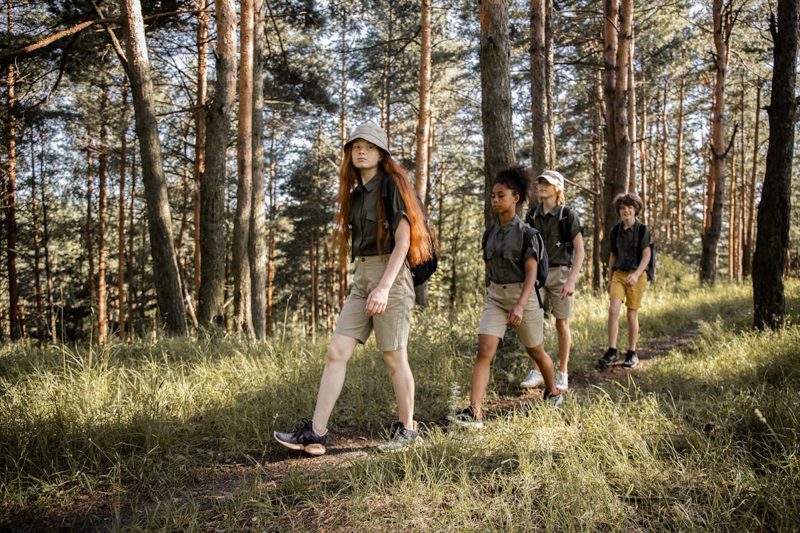 Free Teenagers on an Adventure in a Forest  Stock Photo