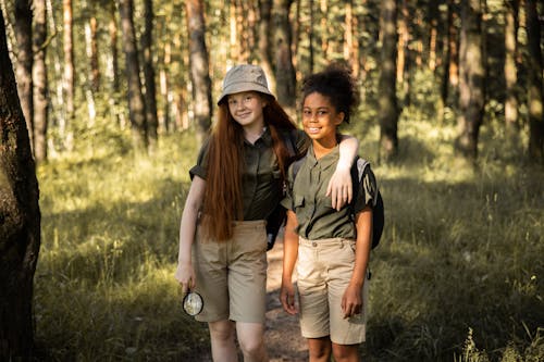 Portrait of Smiling Girls Scouts in Forest