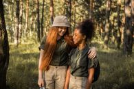 Scout Girls Together in a Forest