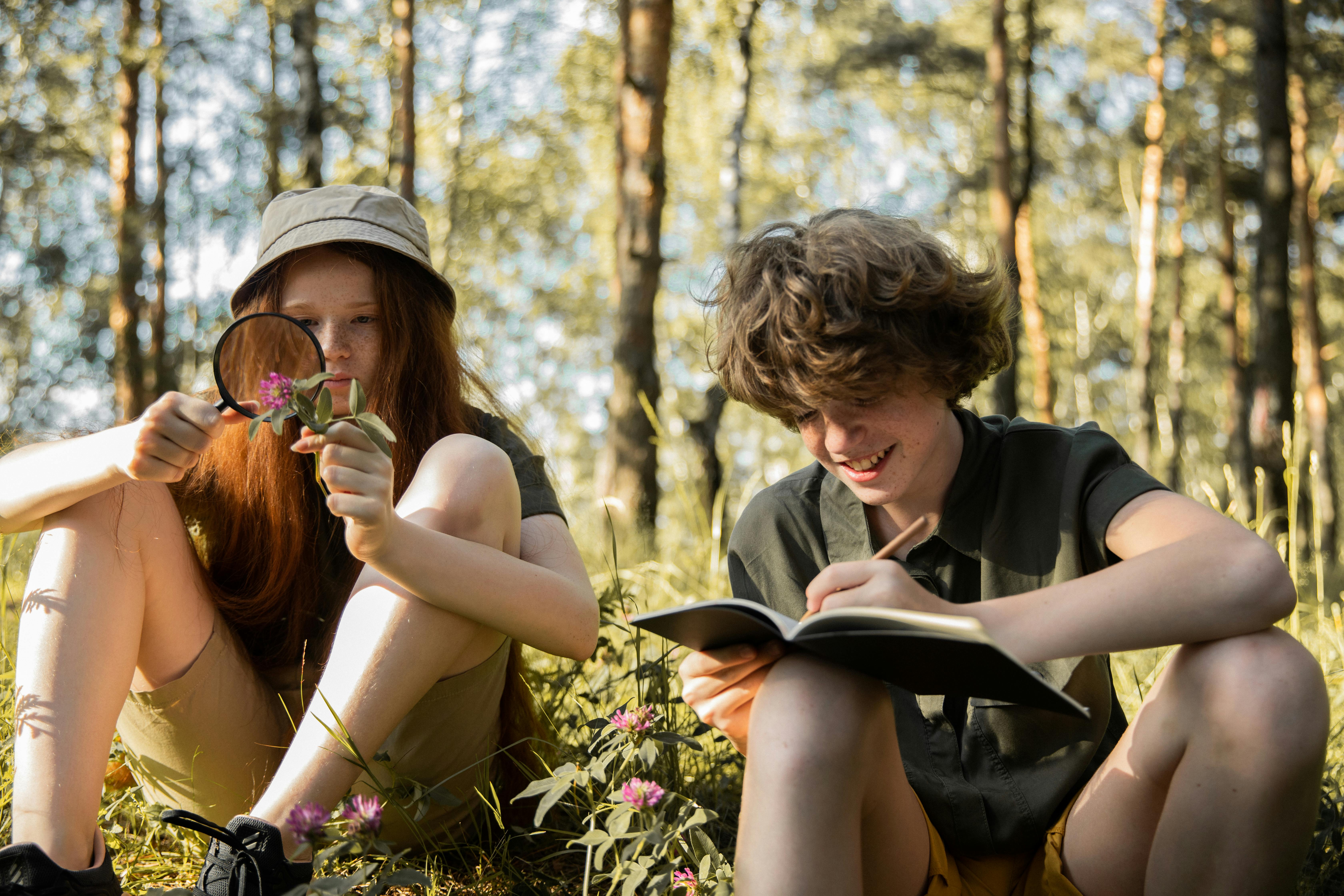 Teenagers explore nature and study outdoors, enjoying a fun and educational adventure.