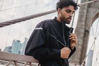Man in Black Jacket Holding Cigarette Stick