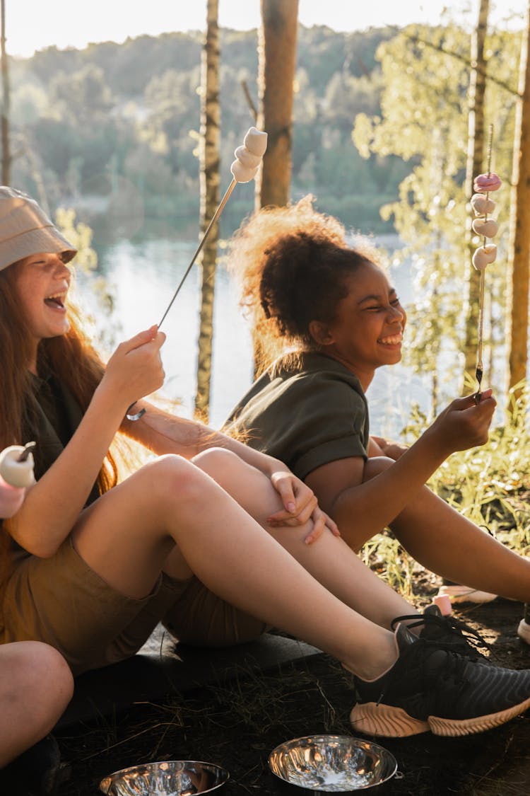 Happy Girls With Campfire Marshmallows