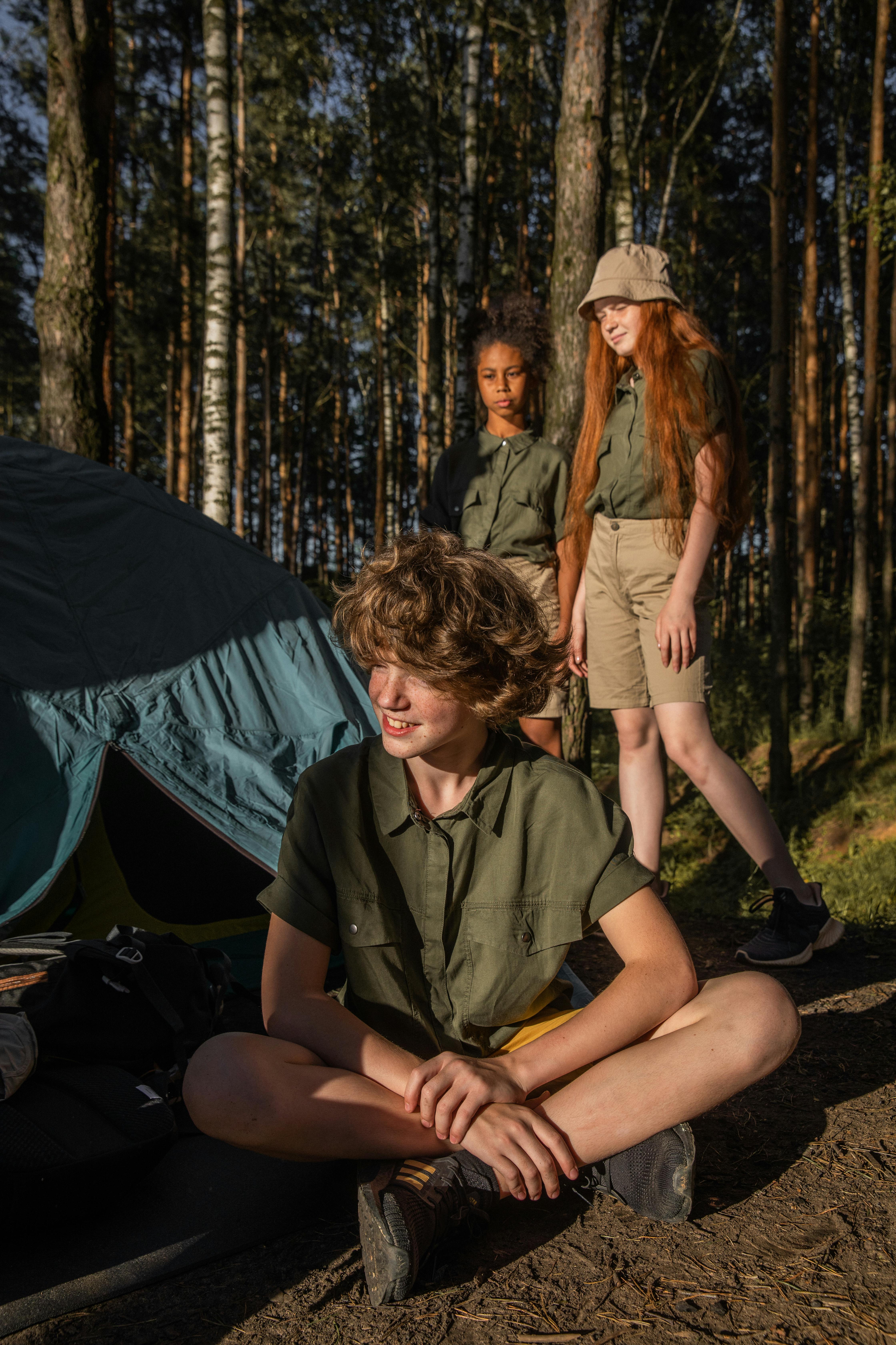 teenagers camping in forest