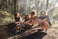 3 Women Sitting on Ground Near Trees