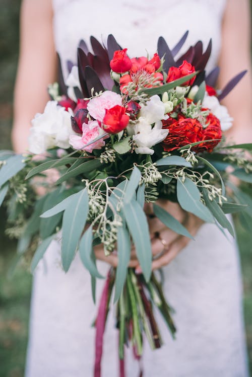Close-up of Bride Holding Flowers Bouquet