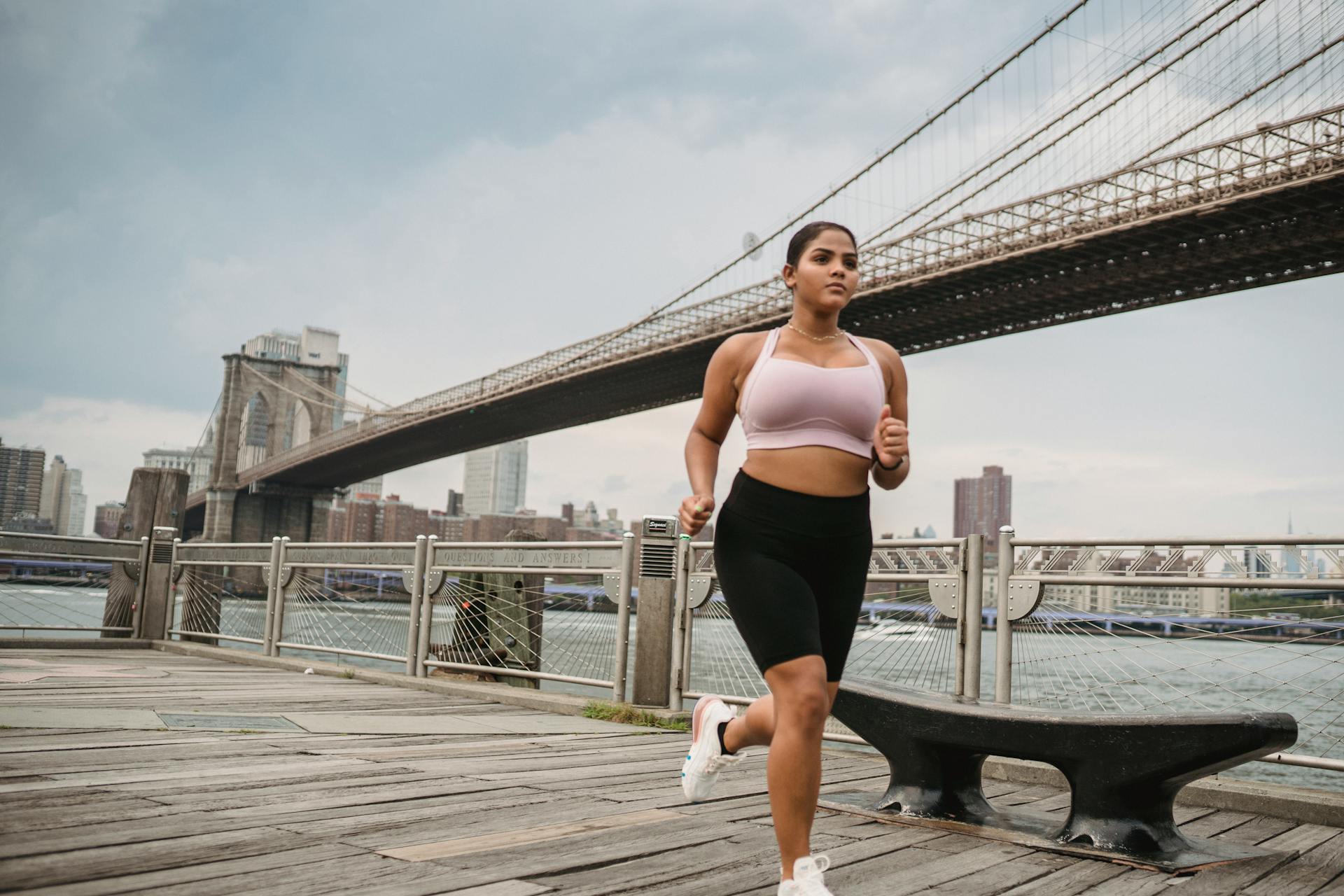 Woman Jogging on Pier