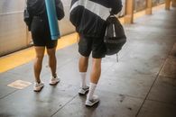 Person in Black Shorts and White Socks