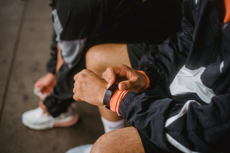 Man Setting Smartwatch Before Exercise