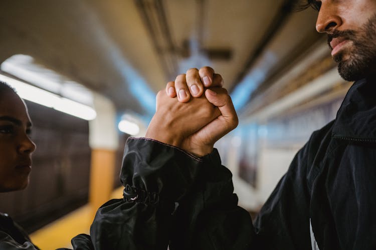 Close-up Of Couple Holding Hands Showing Power