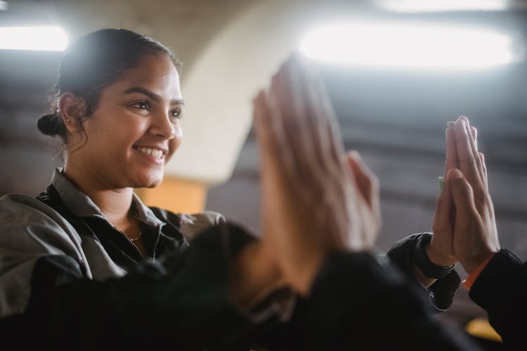 Woman High Fiving Another Person