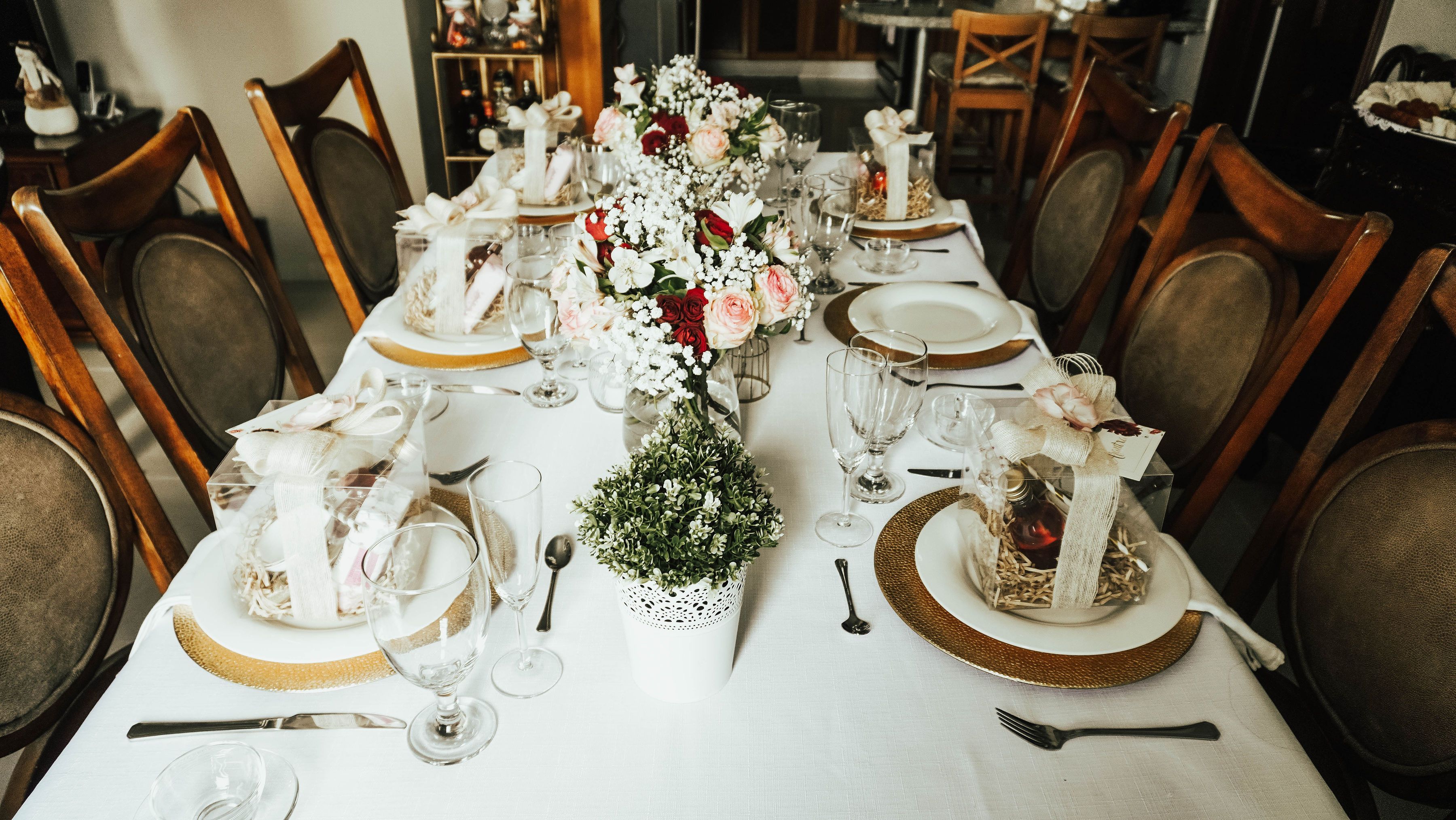 A festive group dinner at Vamos with shared plates and wine on the table