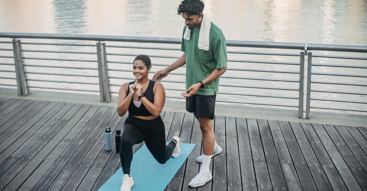 Person doing lunges in a modern Ho apartment with city view