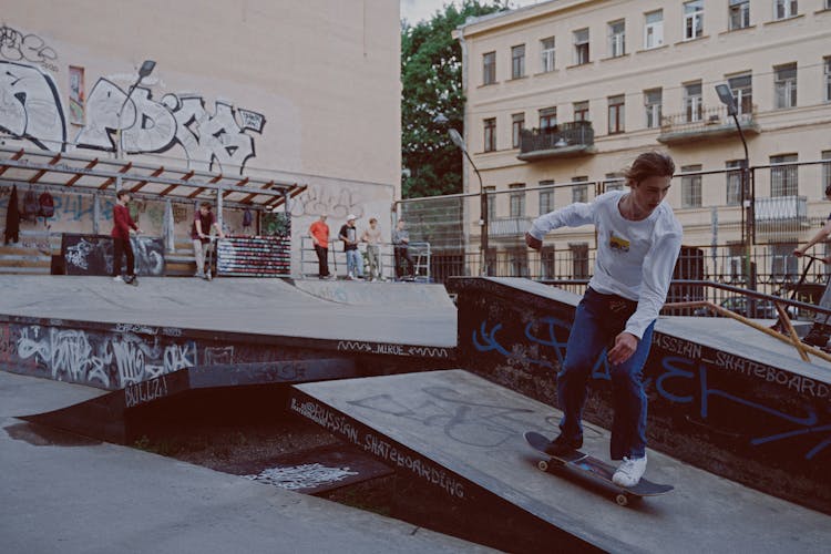 Man Skateboarding On The Skatepark