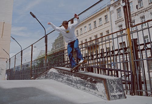 Free Man Skateboarding on the Railings Stock Photo