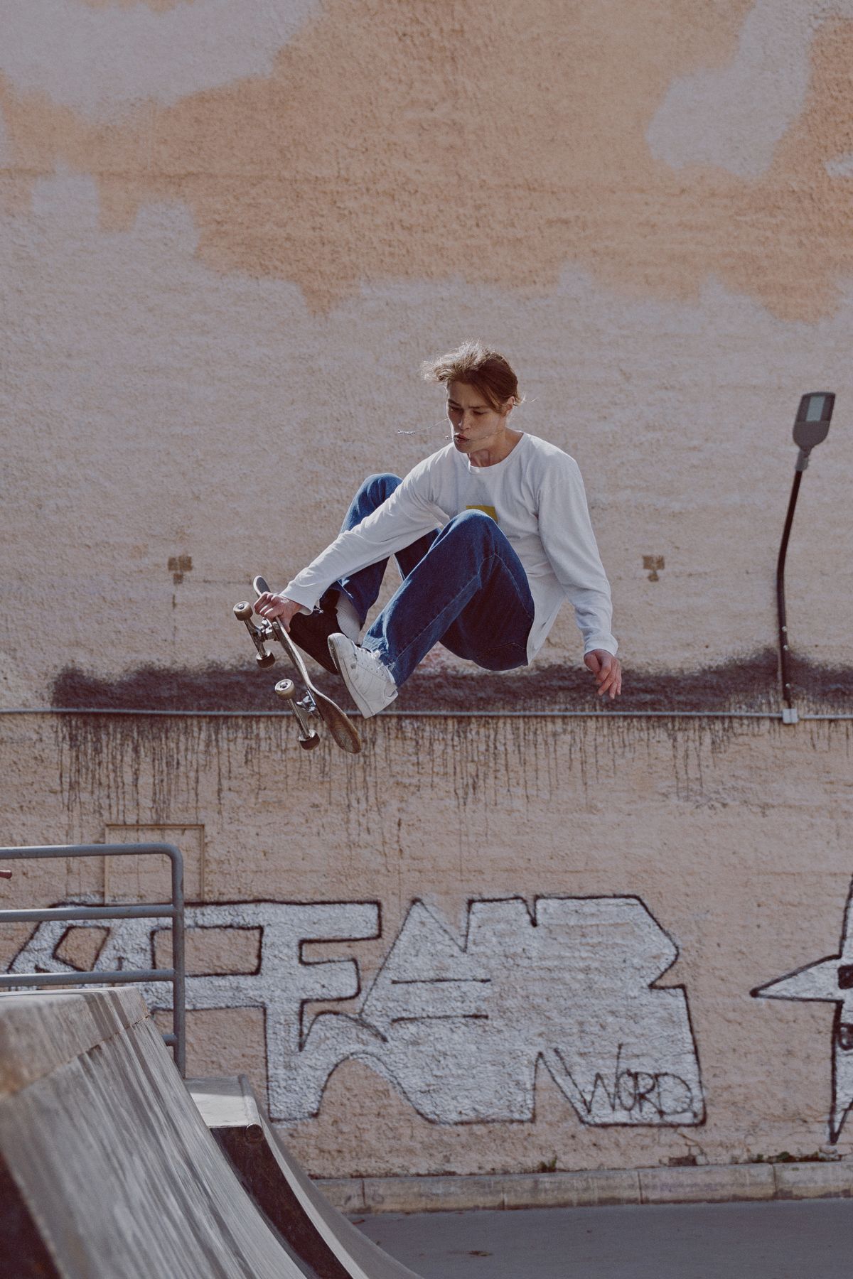 Skateboarder filming an action sports creator post