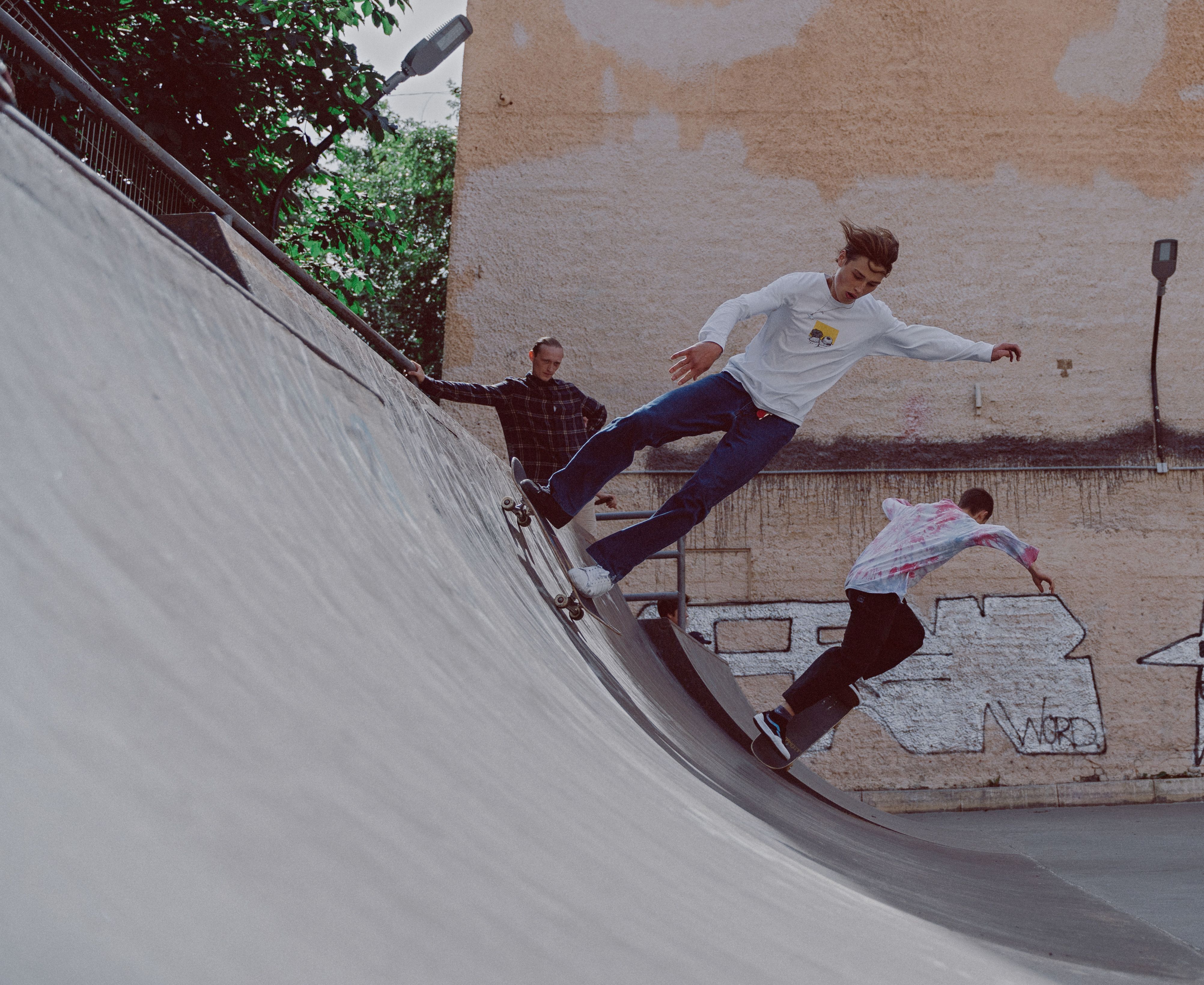 Man Sliding on Metal Railing using Skateboard · Free Stock Photo