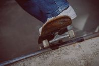 Person in Blue Denim Jeans and Brown Leather Shoes