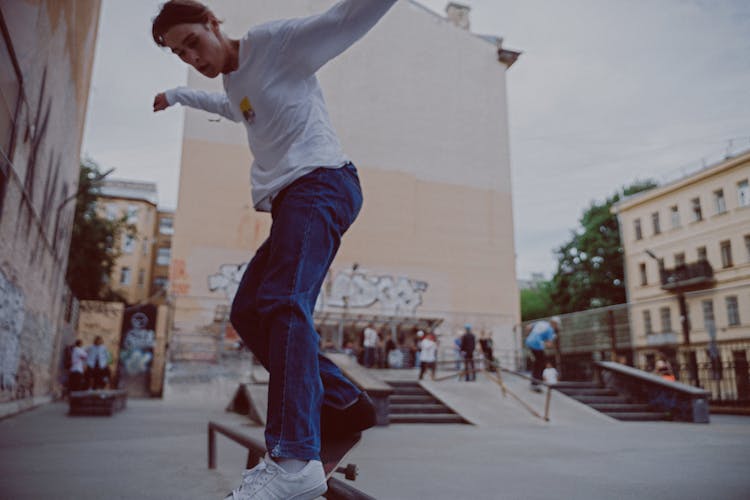 Man Skateboard Grinding On Rail