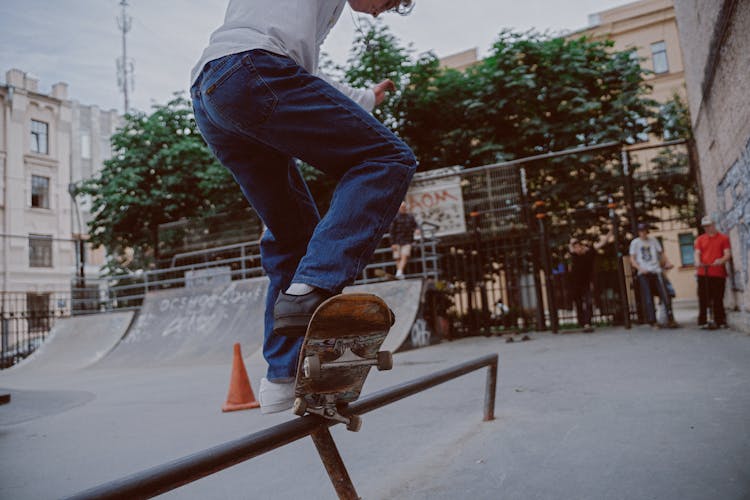 Man Skateboard Grinding On Rail