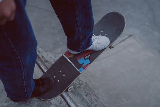 Close-up of a skateboarder executing a trick at an outdoor skatepark.