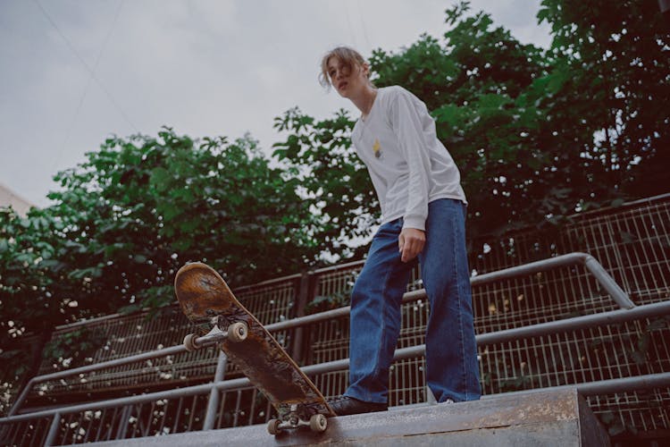 Man Standing On Top Of A Ramp