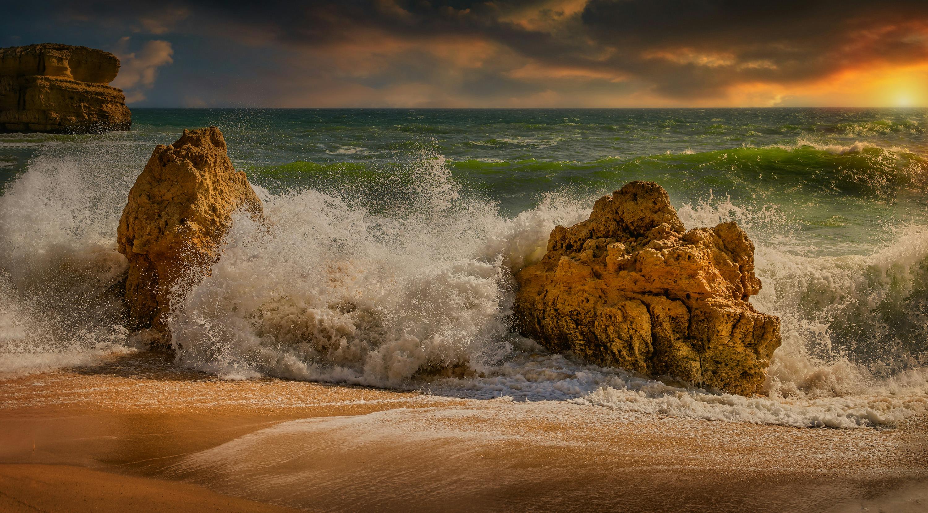 Waves Breaking Against Rocks on Beach Free Stock Photo