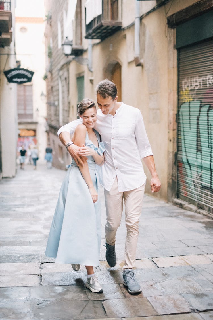 Happy Couple Walking On The Street