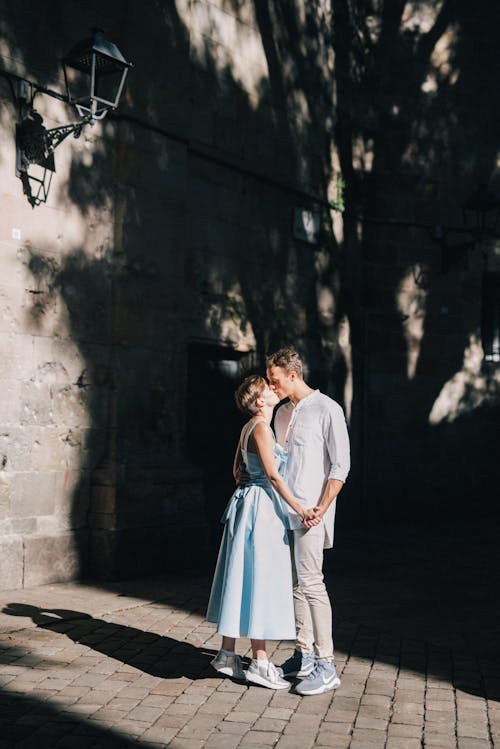 Couple Kissing Beside the Building